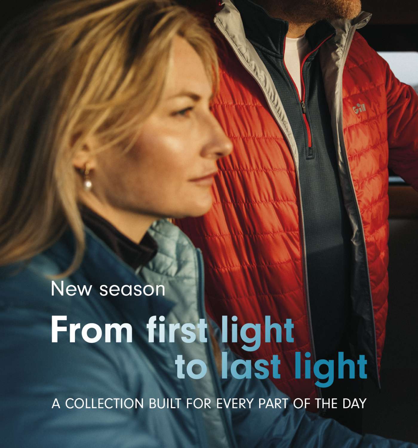 A promotional lifestyle image featuring a woman in a blue puffer jacket and a man in a red puffer jacket, with text overlay reading 'New season From first light to last light A COLLECTION BUILT FOR EVERY PART OF THE DAY'.